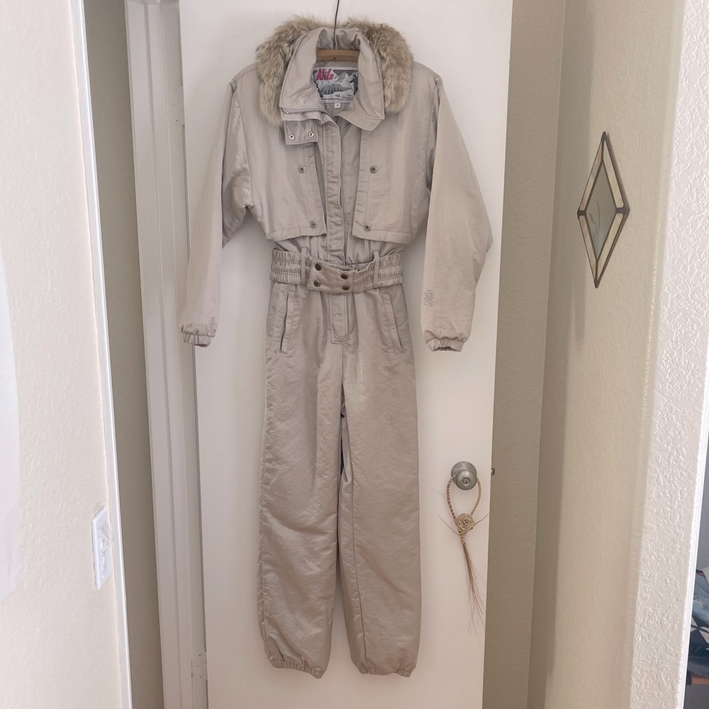Vintage NILS ski suit in near pristine condition. Size 8, real fur collar.